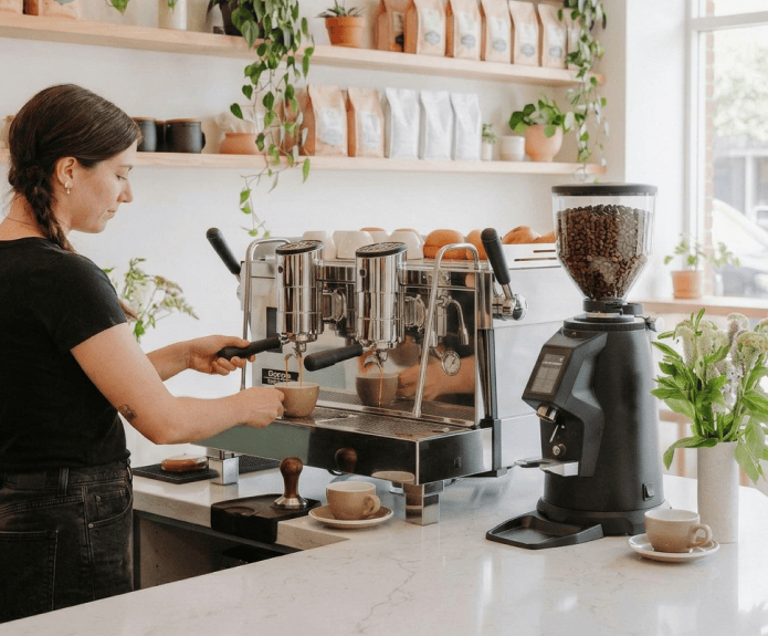 Barista using a commercial espresso machine